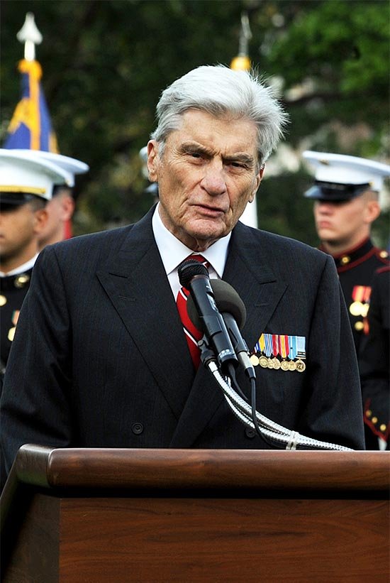 John Warner speaking in a ceremony
